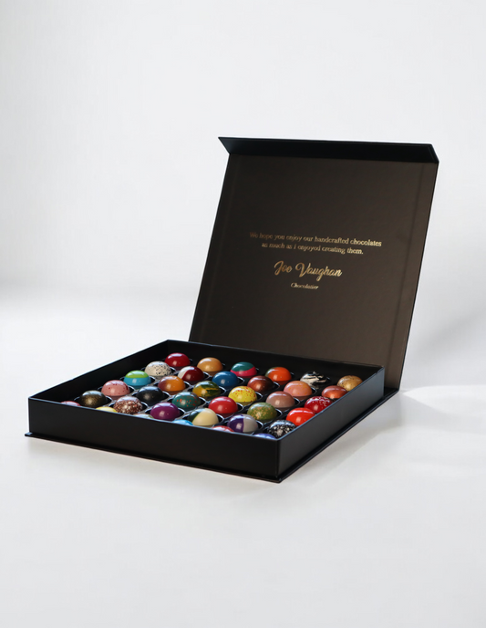 Luxury gift box of 36 handcrafted chocolates in vibrant colors from 1683 Chocolate Place.